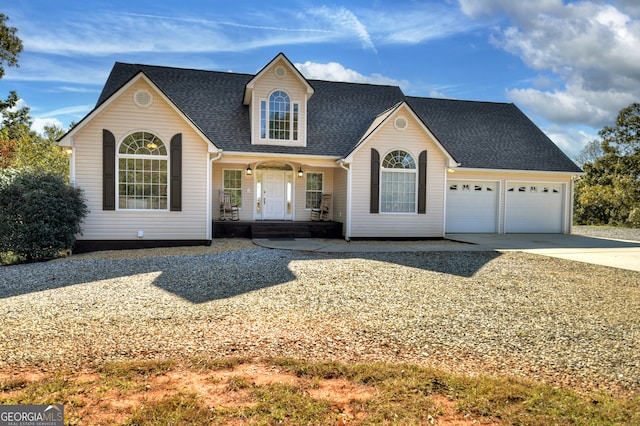 view of front of property with a garage and covered porch