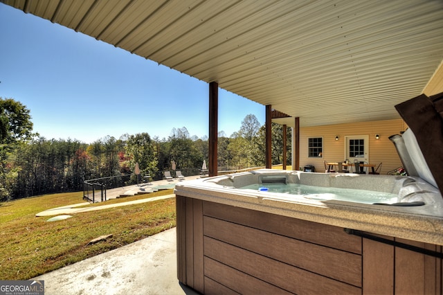 view of patio with a hot tub