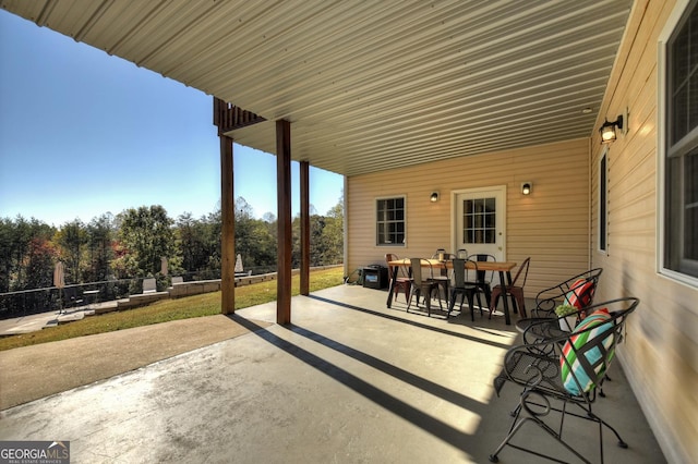 view of patio / terrace featuring outdoor dining area and fence