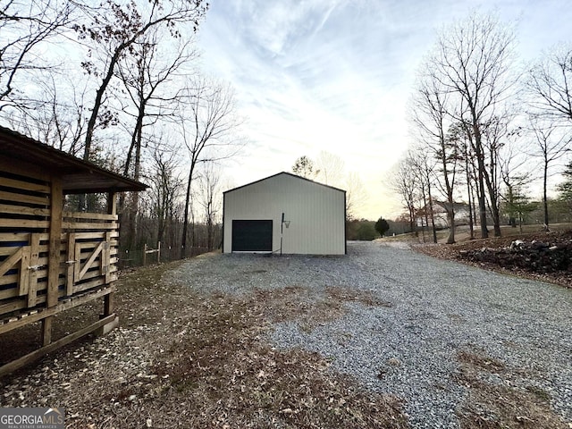 exterior space featuring driveway and an outdoor structure