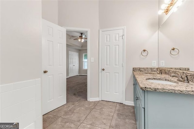 bathroom featuring vanity, ceiling fan, and tile patterned flooring