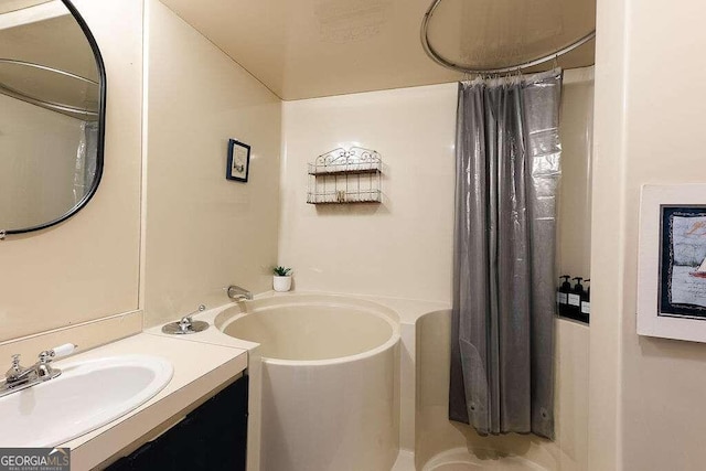 bathroom featuring a bath and vanity