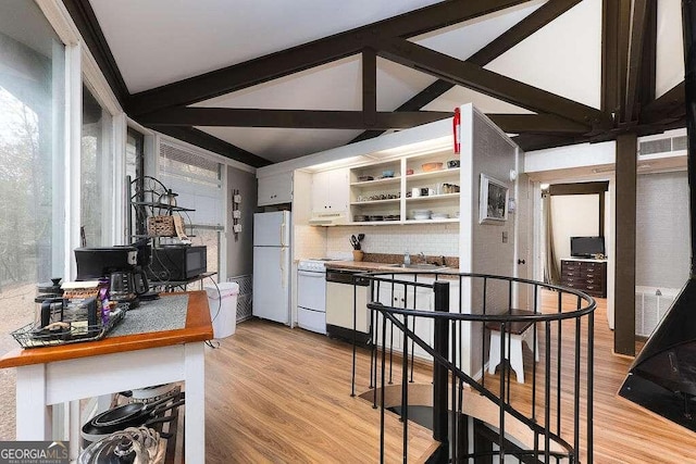 kitchen with light wood-type flooring, white appliances, vaulted ceiling with beams, and white cabinets