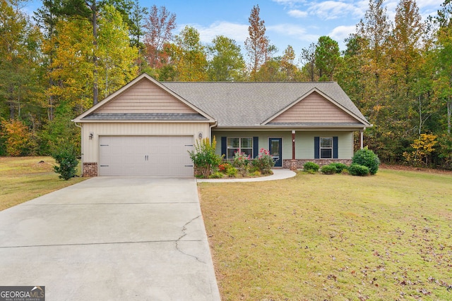 view of front of property featuring a front yard and a garage