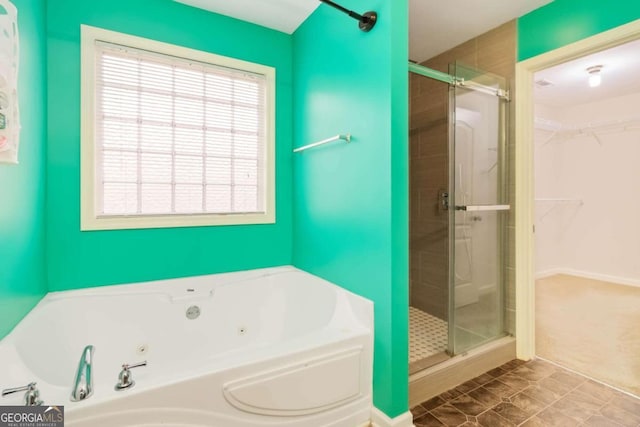 bathroom featuring independent shower and bath and tile patterned floors