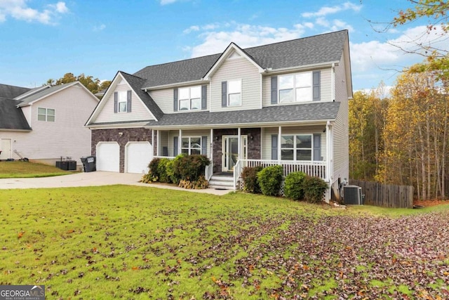 front of property with a front lawn, a garage, central AC, and covered porch