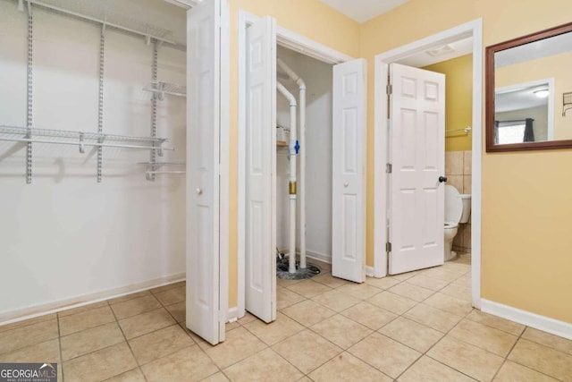 hallway featuring light tile patterned floors