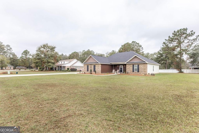 ranch-style home with a front lawn