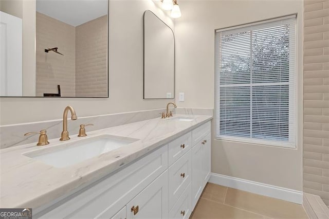 bathroom featuring tile patterned flooring and vanity