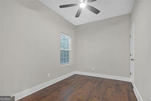 empty room with dark hardwood / wood-style floors and ceiling fan