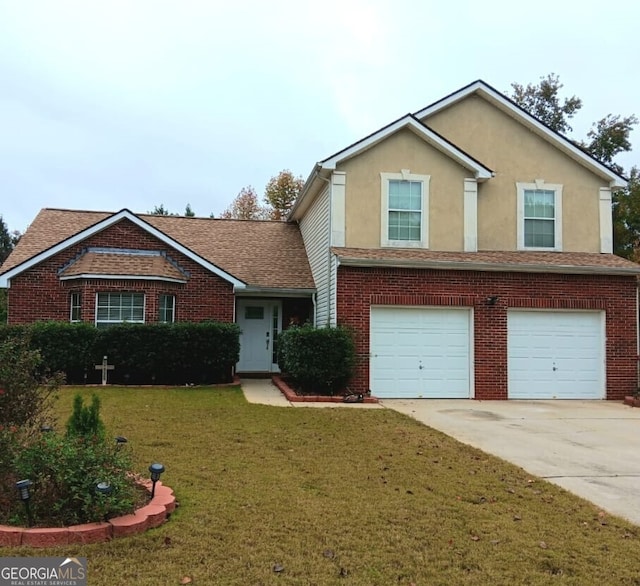 view of front of home with a front yard and a garage