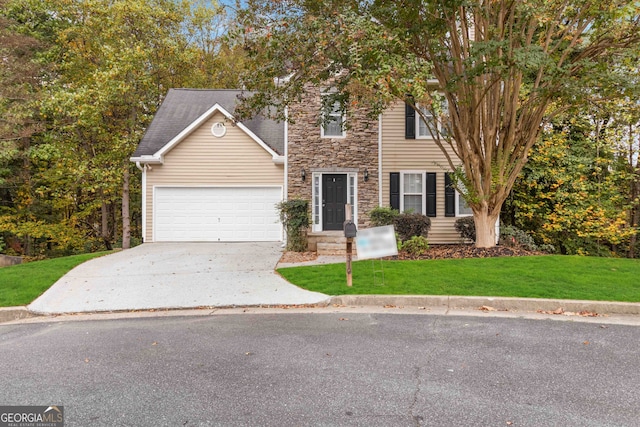 view of front facade featuring a garage and a front yard