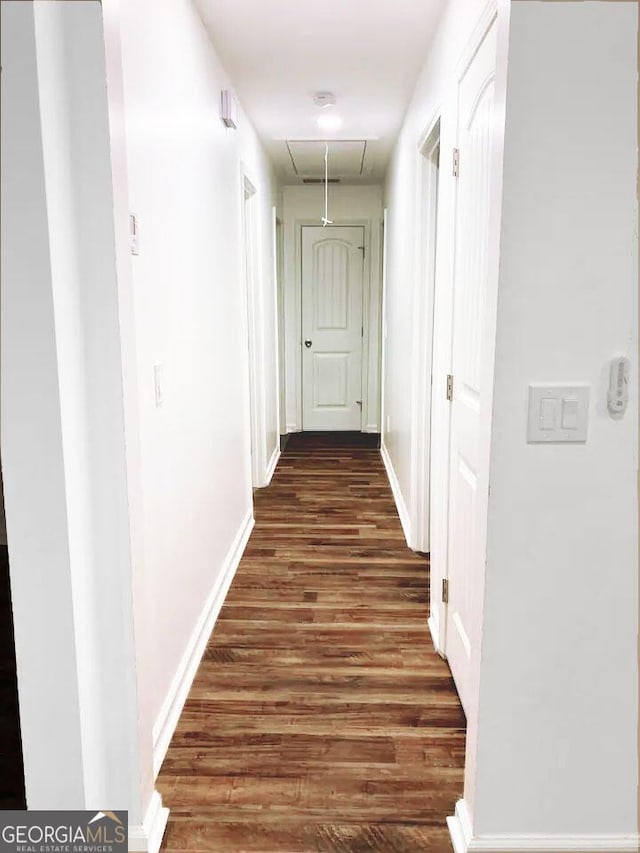 hall with dark hardwood / wood-style floors