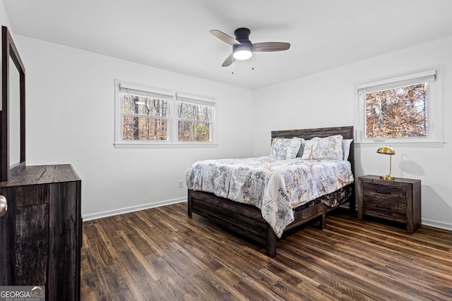 bedroom featuring dark hardwood / wood-style flooring and ceiling fan