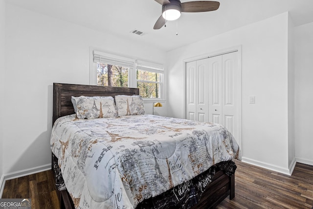 bedroom featuring dark hardwood / wood-style floors, ceiling fan, and a closet