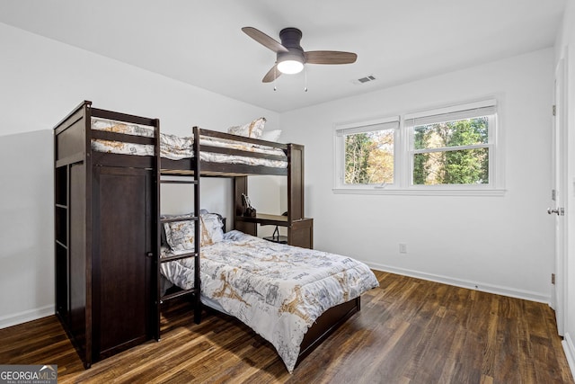 bedroom featuring dark hardwood / wood-style floors and ceiling fan