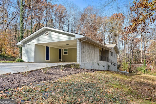 view of side of home with a carport