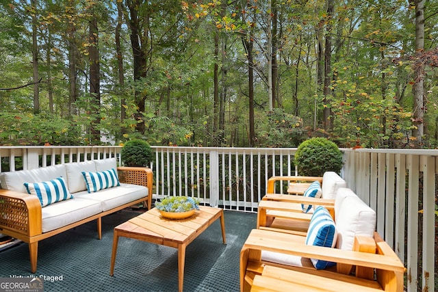 wooden terrace featuring outdoor lounge area