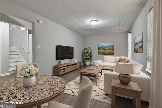 living room featuring a textured ceiling and hardwood / wood-style flooring