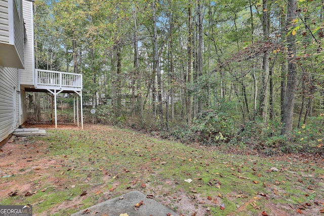 view of yard with a wooden deck