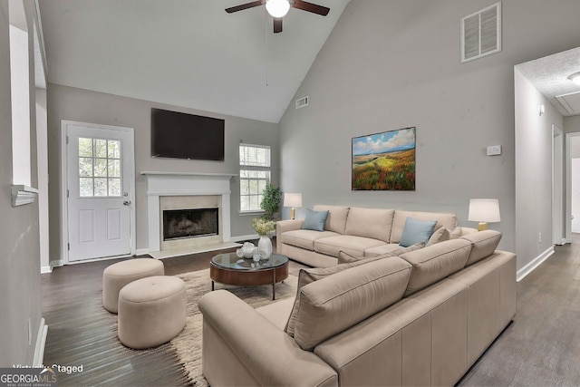 living room featuring high vaulted ceiling, hardwood / wood-style floors, and ceiling fan