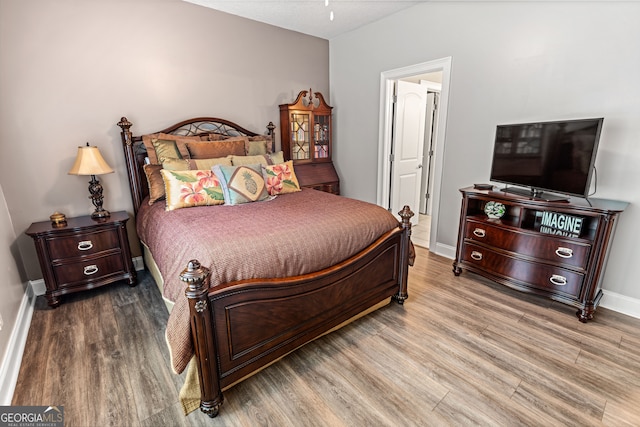 bedroom featuring hardwood / wood-style flooring