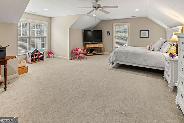 bedroom with light carpet and multiple windows