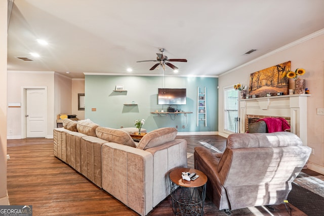 living room featuring ceiling fan, hardwood / wood-style floors, and ornamental molding