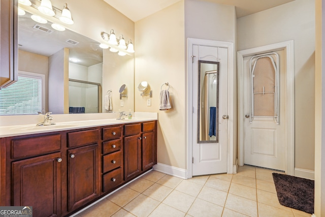 bathroom with vanity and tile patterned floors