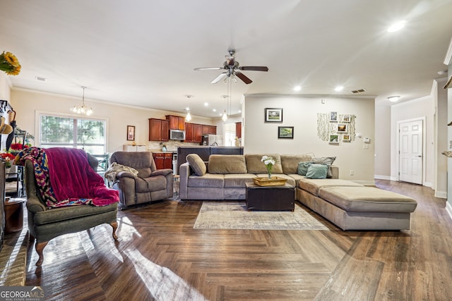 living room featuring ceiling fan with notable chandelier and ornamental molding