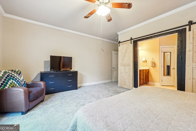 bedroom featuring a barn door, ceiling fan, connected bathroom, and carpet flooring