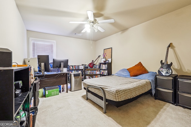 bedroom featuring ceiling fan and light carpet