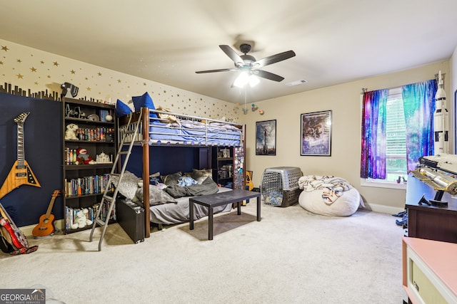 bedroom featuring ceiling fan and carpet