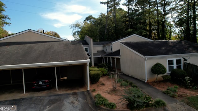 view of home's exterior featuring a carport