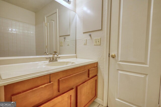 tiled spare room with a textured ceiling