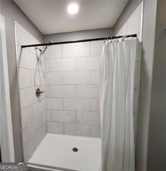 bathroom with a shower with shower curtain