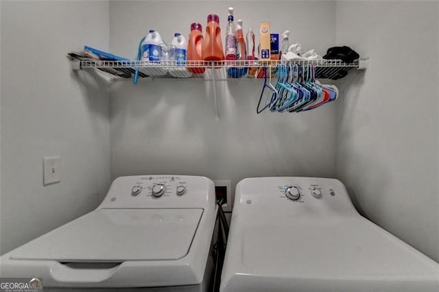 laundry area with independent washer and dryer