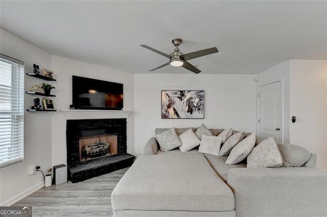 bedroom with ceiling fan and light hardwood / wood-style flooring