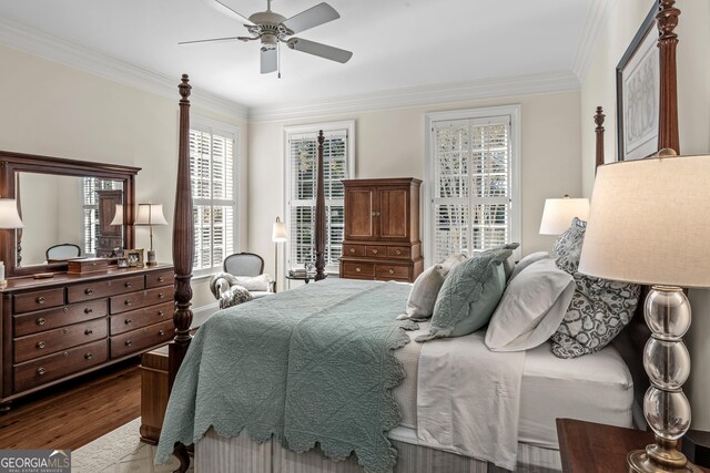 interior details featuring hardwood / wood-style flooring, ornamental molding, and ceiling fan