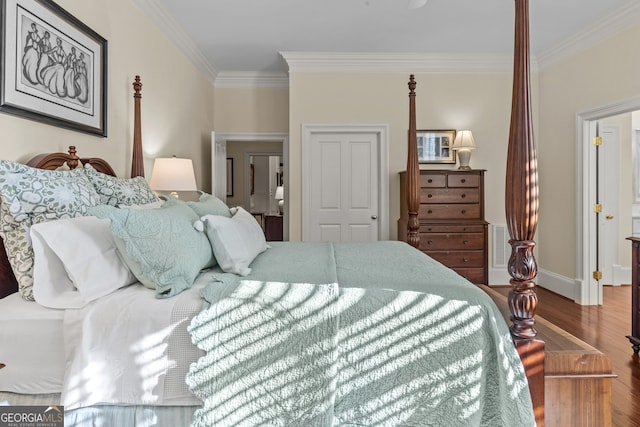 bedroom with wood-type flooring and ornamental molding