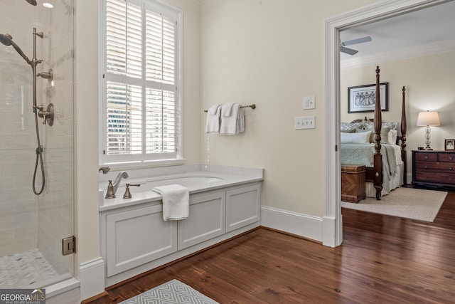 bathroom featuring hardwood / wood-style flooring, ornamental molding, shower with separate bathtub, and ceiling fan