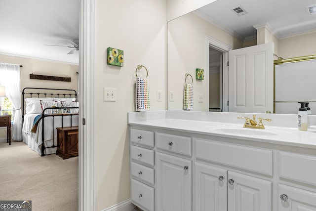 bathroom featuring crown molding, vanity, ceiling fan, and walk in shower