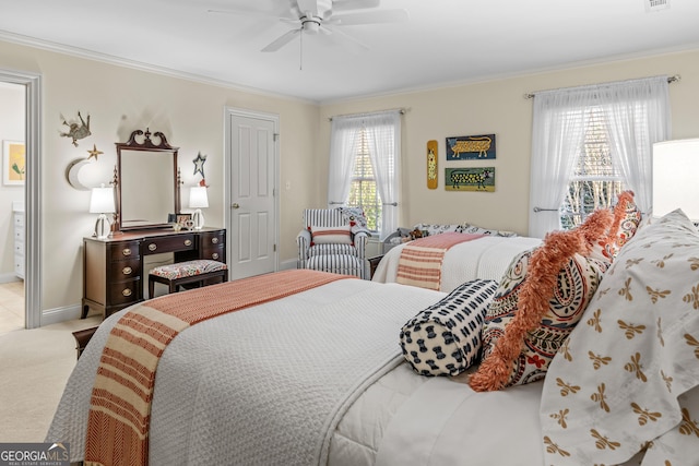 carpeted bedroom featuring crown molding, ceiling fan, and multiple windows