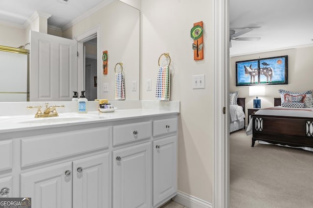 bathroom featuring ornamental molding, vanity, and ceiling fan