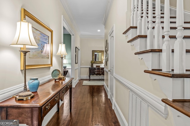 corridor featuring ornamental molding and dark hardwood / wood-style flooring