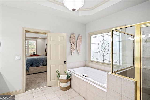 bathroom featuring a tray ceiling, shower with separate bathtub, tile patterned flooring, and crown molding