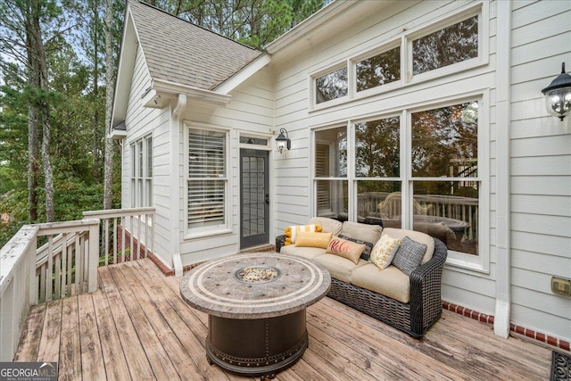 deck featuring an outdoor fire pit