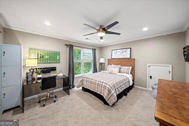 carpeted bedroom with ceiling fan and crown molding