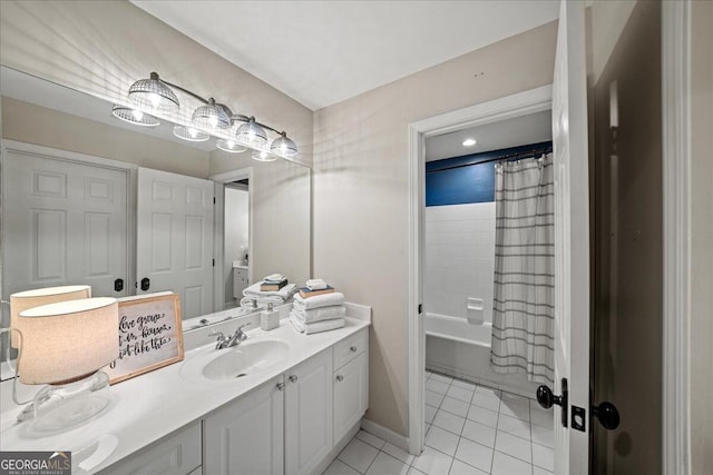 bathroom featuring vanity, shower / bath combo with shower curtain, and tile patterned flooring