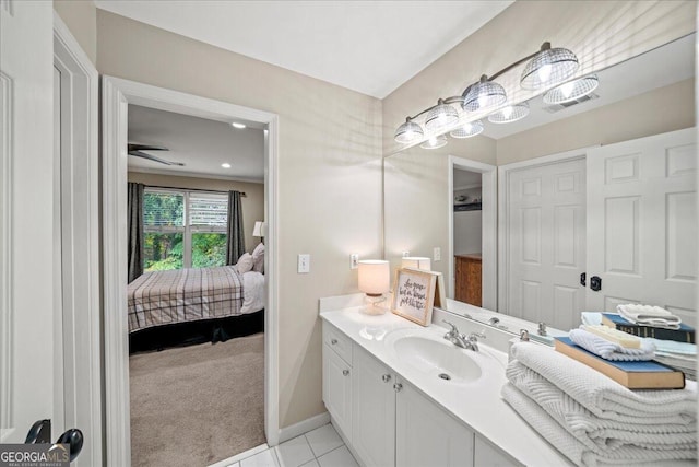 bathroom featuring tile patterned flooring and vanity